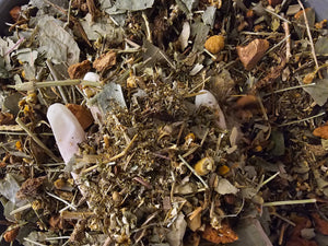 Organic herbal mix for detox tea, featuring a blend of dried leaves and flowers for full body cleansing.