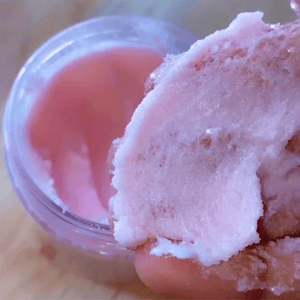 Fleurissent Rose Body Scrub with pink creamy texture for exfoliating skin.