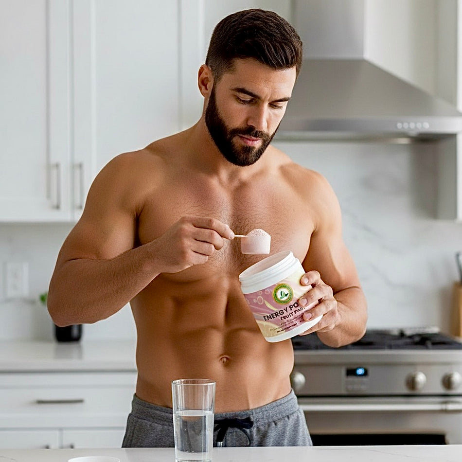 Man in a kitchen preparing a protein shake with a container labeled 'Energy Power'.